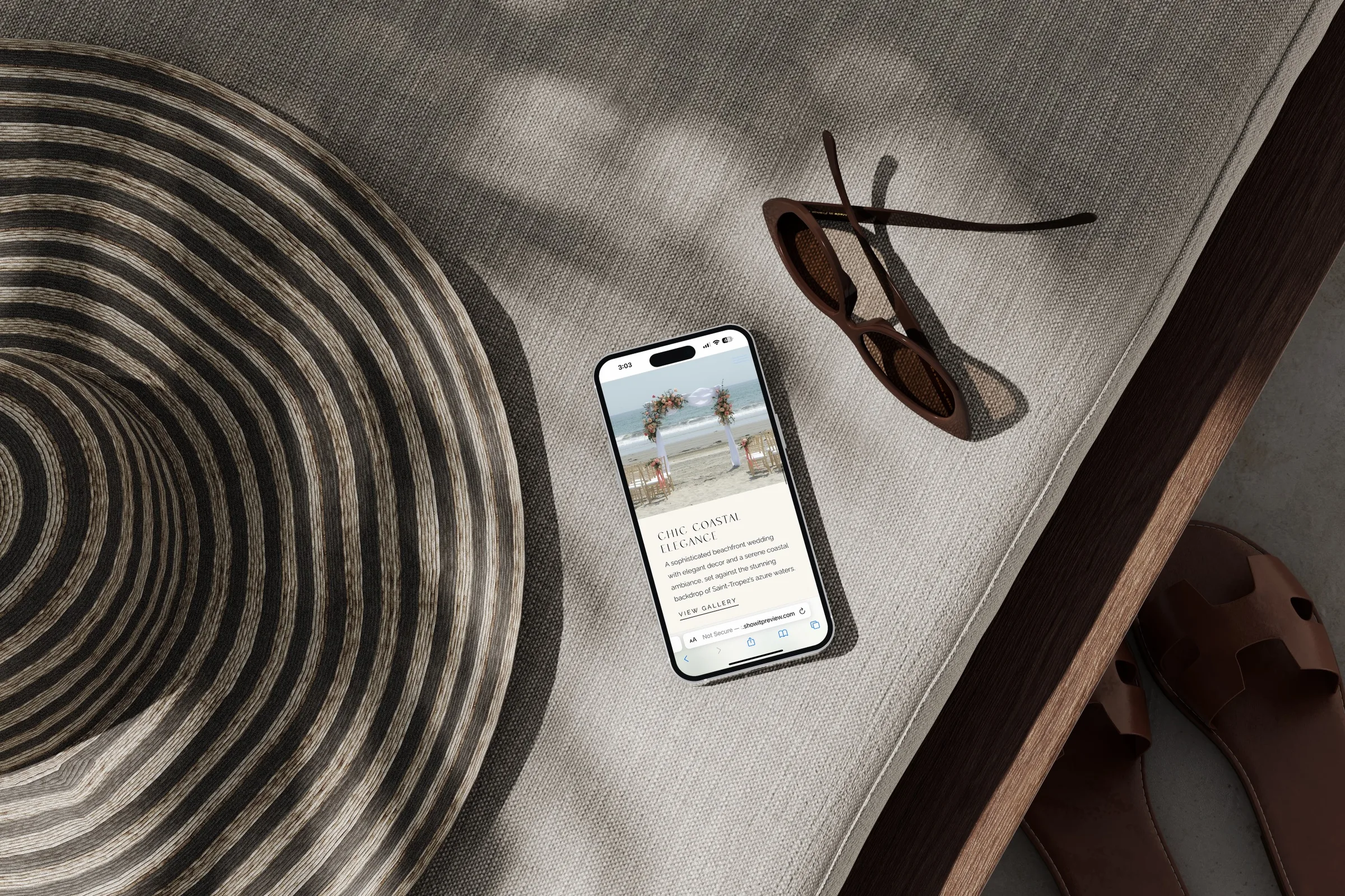Isabella Devereaux wedding website displayed on an iPhone resting on a linen-draped bench